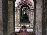 Kathmandu Pashupatinath 16 Chaityas Stupas With Lingam After crossing the Bagmati River at Pashupatinath near Kathmandu, Charlotte noticed how the 11 small stone Chaityas (stupas), each with a lingam, lined up nicely to give a seemingly endless mirror effect.